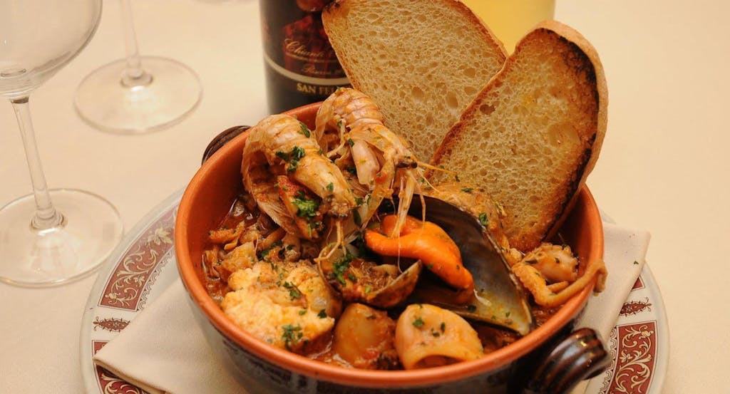 Zuppa di pesce e frutti di mare dell'Osteria Il Porto - Fonte: Quandoo